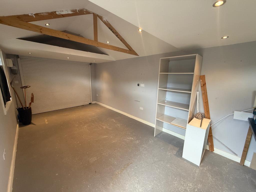 Lot: 134 - SEMI-DETACHED BUNGALOW FOR IMPROVEMENT - Garage/workshop with electric door